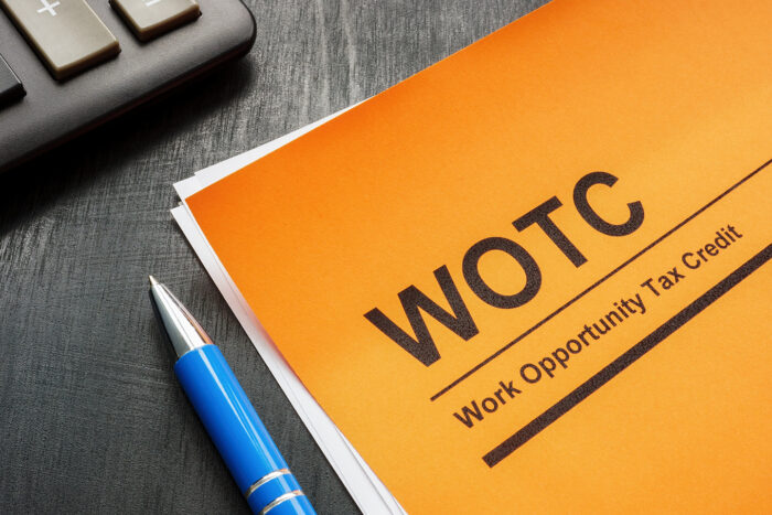 Photo of a Work Opportunity Tax Credit (WOTC) application and a pen.