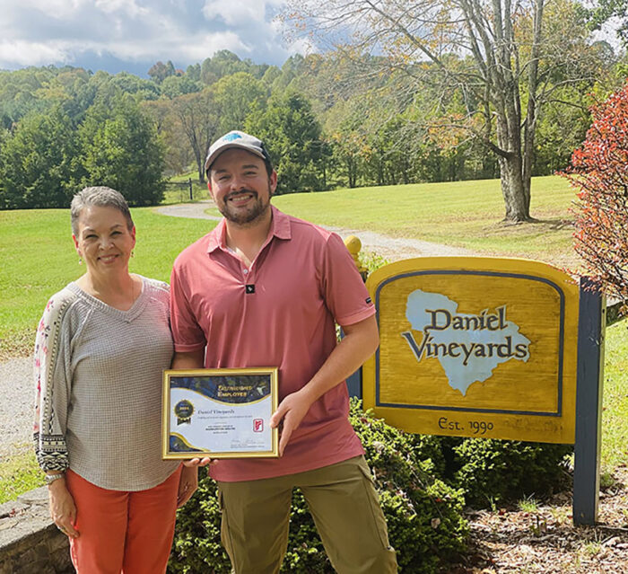 DRS presents framed certificate to Daniel Vineyards representative