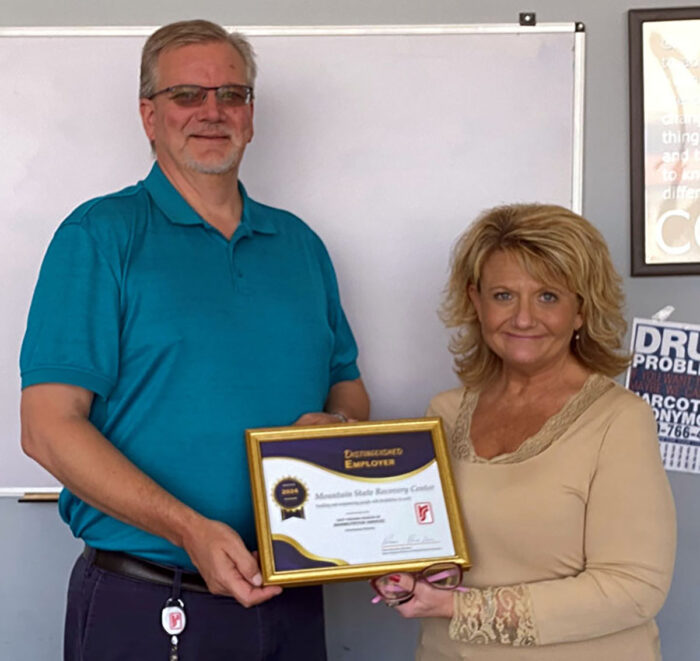 DRS presents framed certificate to Mountain State Recovery Center representative