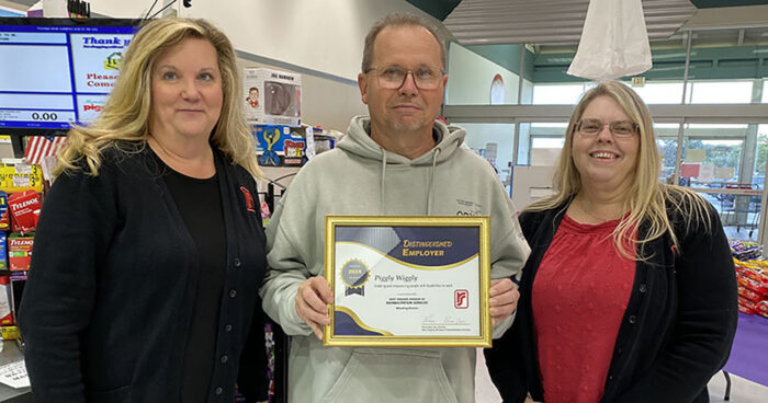 DRS presents framed certificate to Piggly Wiggly representative